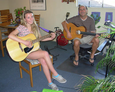 Dave teaching guitar lessons at his Soquel Studio within the Santa Cruz Area